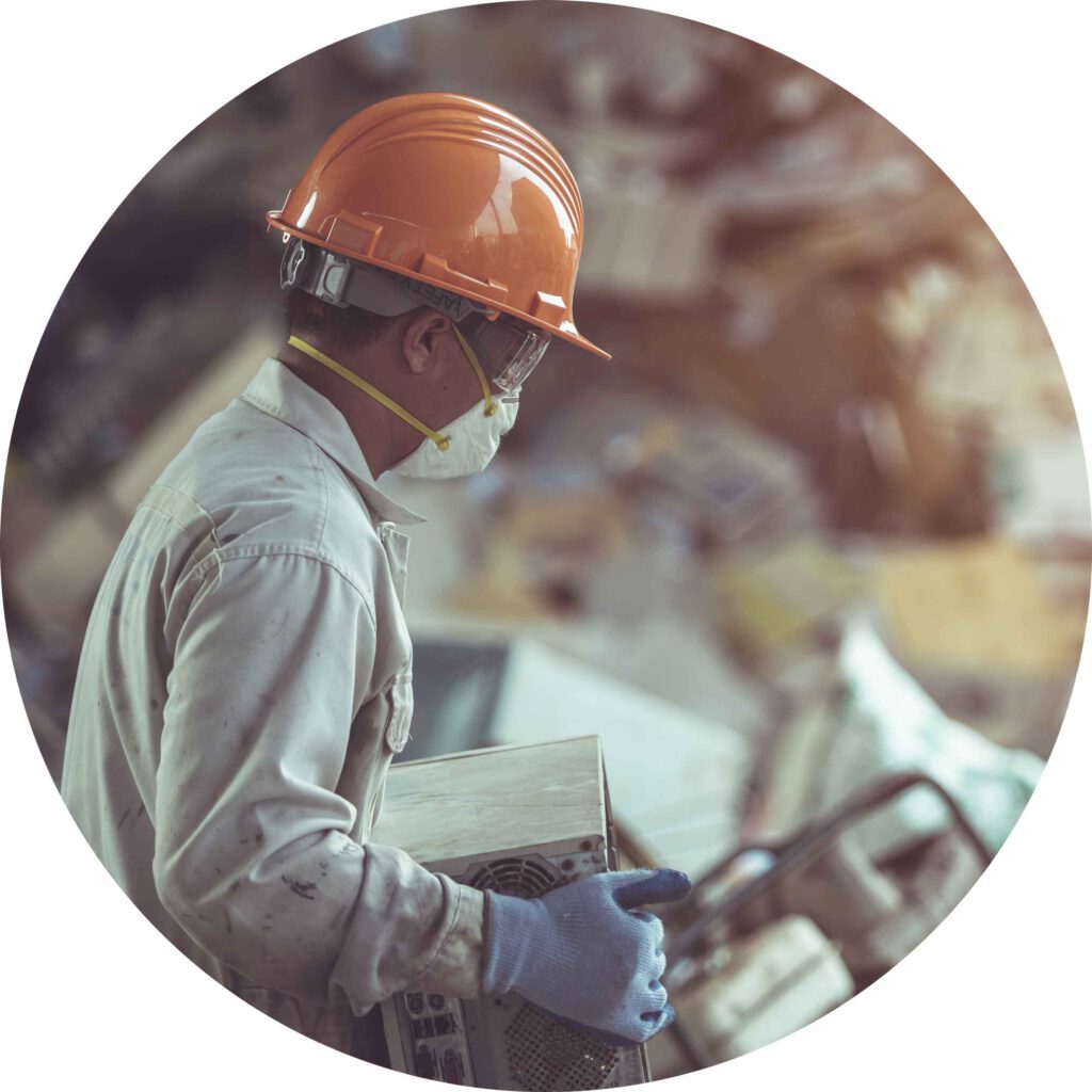 Rounded image of a worker wearing protection material while working in a waste management facility